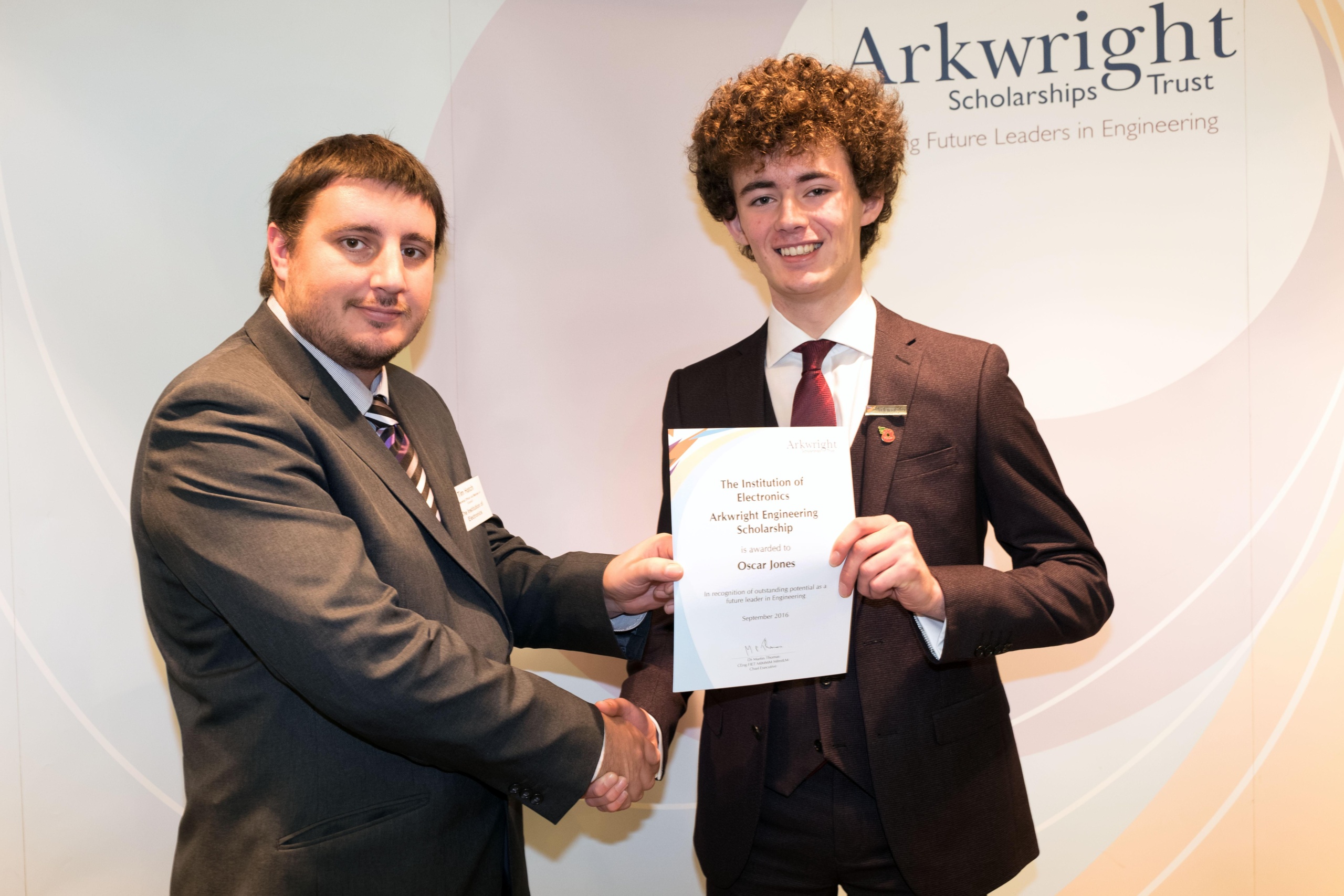 cheadle hulme school sixth form student Oscar collects his Arkwright Engineering Scholarship in Edinburgh with a representative from the Institute of Electronics